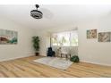 Living room showcasing updated lighting, fresh paint and natural light at 4302 Nepal St, Denver, CO 80249
