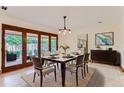 Elegant dining room with large windows and backyard access at 5635 E 17Th Avenue Pkwy, Denver, CO 80220