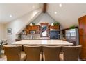 Spacious kitchen island with bar seating, granite countertops, stainless steel appliances, and ample cabinet space at 302 N Main St, Breckenridge, CO 80424