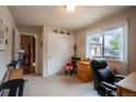 Cozy room with neutral walls, plush carpet, and natural light from the window, great space to work from home at 2151 Burbank St, Berthoud, CO 80513