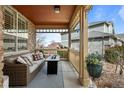 Relaxing covered porch with comfortable seating and decorative accents is perfect for enjoying the outdoors at 23101 Timber Spring Ln, Parker, CO 80138