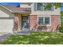Brick and siding exterior with front porch and well-maintained lawn at 9946 Harrison St, Thornton, CO 80229