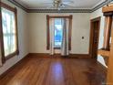 Cozy bedroom with hardwood floors and ample natural light streaming through the windows at 1646 Galena St, Aurora, CO 80010