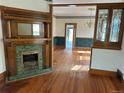 View of the spacious living room highlighting the fireplace and built-in display cabinet at 1646 Galena St, Aurora, CO 80010