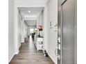 Inviting entryway with beautiful hardwood floors and bright, neutral walls at 8661 S De Gaulle Ct, Aurora, CO 80016