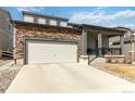 Attractive two-story home with a two-car garage and stone detailing on the exterior at 12759 Buffington Trl, Parker, CO 80134