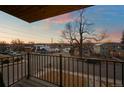 Scenic balcony view showcasing the neighborhood with colorful skies during dusk and charming houses at 2890 S Sherman St, Englewood, CO 80113