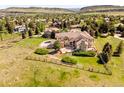 Expansive view of the property and surrounding neighborhood from above with a wood fence at 27 Tamarade Dr, Littleton, CO 80127