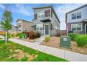 A quaint two-story home showcases neutral siding and manicured landscaping, creating a welcoming street presence at 847 Great Plains Ave, Berthoud, CO 80513