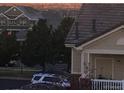 A suburban house shows the architecture and landscaping of the property at 5726 N Genoa Way # 301, Aurora, CO 80019