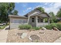 Inviting single-story home showcasing a well-maintained exterior and landscaped front yard at 109 W Simpson St, Lafayette, CO 80026