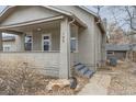 Close up of the front porch with the house number and stone landscaping at 109 W Simpson St, Lafayette, CO 80026