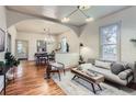 Open living space with hardwood floors and stylish decor including a sofa and coffee table at 109 W Simpson St, Lafayette, CO 80026
