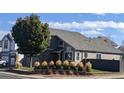 A view of the home that features mature landscaping and trees plus neutral exterior paint at 9768 Otis Dr, Westminster, CO 80021