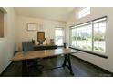 Bright office space with large windows, wood floors, modern desk and lots of natural light at 9768 Otis Dr, Westminster, CO 80021