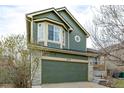 Attractive home featuring stone accents, bay windows, and a cute covered front porch at 6358 E 121St Pl, Brighton, CO 80602