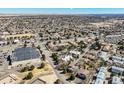 Aerial view of home in a community featuring mature trees, nearby businesses, and roadways at 15157 E Louisiana Dr # A, Aurora, CO 80012