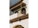 Architectural details showcase the wood beam supported overhang, the curved windows, and red tile roof at 3 Carriage Brook Rd, Cherry Hills Village, CO 80121