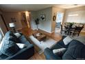 Inviting living room with stylish sofas, hardwood floors, and plenty of natural light at 2592 S Winona Ct, Denver, CO 80219