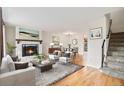 Inviting living room with a fireplace, light wood floors, and an elegant area rug at 412 Gladiola St, Golden, CO 80401