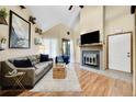 Cozy living room features a stone fireplace, hardwood floors, and a neutral color palette, creating a warm and inviting space at 830 S Vance St # F, Lakewood, CO 80226