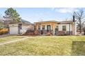 Charming home showcasing a well-kept lawn, stone accents, and a covered front porch, enhancing curb appeal at 3380 Longwood Ave, Boulder, CO 80305