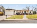 Charming ranch-style home with a manicured lawn and attached garage at 3380 Longwood Ave, Boulder, CO 80305