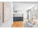 Bright, airy open concept kitchen featuring an island with stool seating and abundant natural light at 3380 Longwood Ave, Boulder, CO 80305