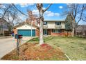 Charming two-story home with a spacious yard and a two-car garage at 6431 W Arbor Ave, Littleton, CO 80123