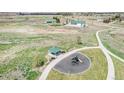 Aerial view showcasing a park with a playground, gazebo, and nearby community amenities, enhancing the neighborhood's appeal at 5736 Cadara Way, Parker, CO 80134