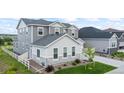 Attractive two-story home boasting modern siding, stone accents, and a well-kept lawn at 5736 Cadara Way, Parker, CO 80134