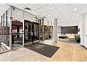 Bright, tiled lobby area with seating, glass entryway, and decorative details at 2 Adams St # 608, Denver, CO 80206
