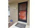 Close-up of the front door with mosaic house number and ADT security sign at 2043 S Salida St, Aurora, CO 80013