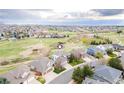 Expansive aerial view of home and surrounding neighborhood with a park and walking trails nearby at 446 Angus Way, Highlands Ranch, CO 80129