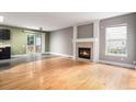 Spacious living room with a fireplace and sliding glass doors at 2786 S Cathay Way, Aurora, CO 80013
