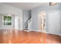 Bright living room featuring hardwood floors and a staircase at 2786 S Cathay Way, Aurora, CO 80013