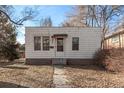 Exterior view of a single-story home with a walkway leading to the front door and a small yard at 367 S Jasmine St, Denver, CO 80224