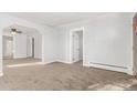Neutral carpet and light walls create a bright and airy living space at 367 S Jasmine St, Denver, CO 80224