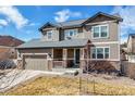 Charming two-story home with a well-maintained lawn and a two-car garage at 12017 Triple Crown Dr, Parker, CO 80134