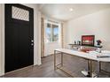 Bright and airy office space with a marble desk and ample natural light at 760 N Allium St, Watkins, CO 80137