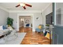 Inviting living room with hardwood floors, open layout, and a ceiling fan at 3647 Jason St, Denver, CO 80211