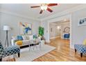 Comfortable living room with neutral tones, hardwood floors, and a view to the office space at 3647 Jason St, Denver, CO 80211