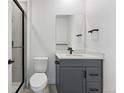 Modern bathroom featuring sleek vanity, black hardware, and glass shower doors at 16565 Black Rose Cir, Parker, CO 80134