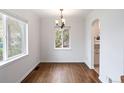 Bright dining room with natural light and hardwood floors at 1213 Jamaica St, Aurora, CO 80010