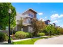 Well maintained two-story home with professional landscaping, a sidewalk, and a street lamp at 8774 Martin Luther King Blvd, Denver, CO 80238