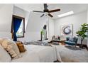 Bright bedroom with ceiling fan, large window, and comfortable seating area at 1001 E 17Th Ave # 12, Denver, CO 80218