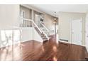 Spacious living room with hardwood floors and staircase at 19136 E Milan Cir, Aurora, CO 80013