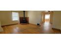 Inviting living room featuring hardwood floors, a brick fireplace, and bright, natural light at 1409 S Clermont St, Denver, CO 80222