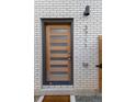 Close-up of the front door, showcasing its modern design and the house number at 3711 Pecos St, Denver, CO 80211