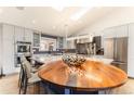 Modern kitchen features a large island, stainless steel appliances, and ample counter space at 10395 W 74Th Pl, Arvada, CO 80005